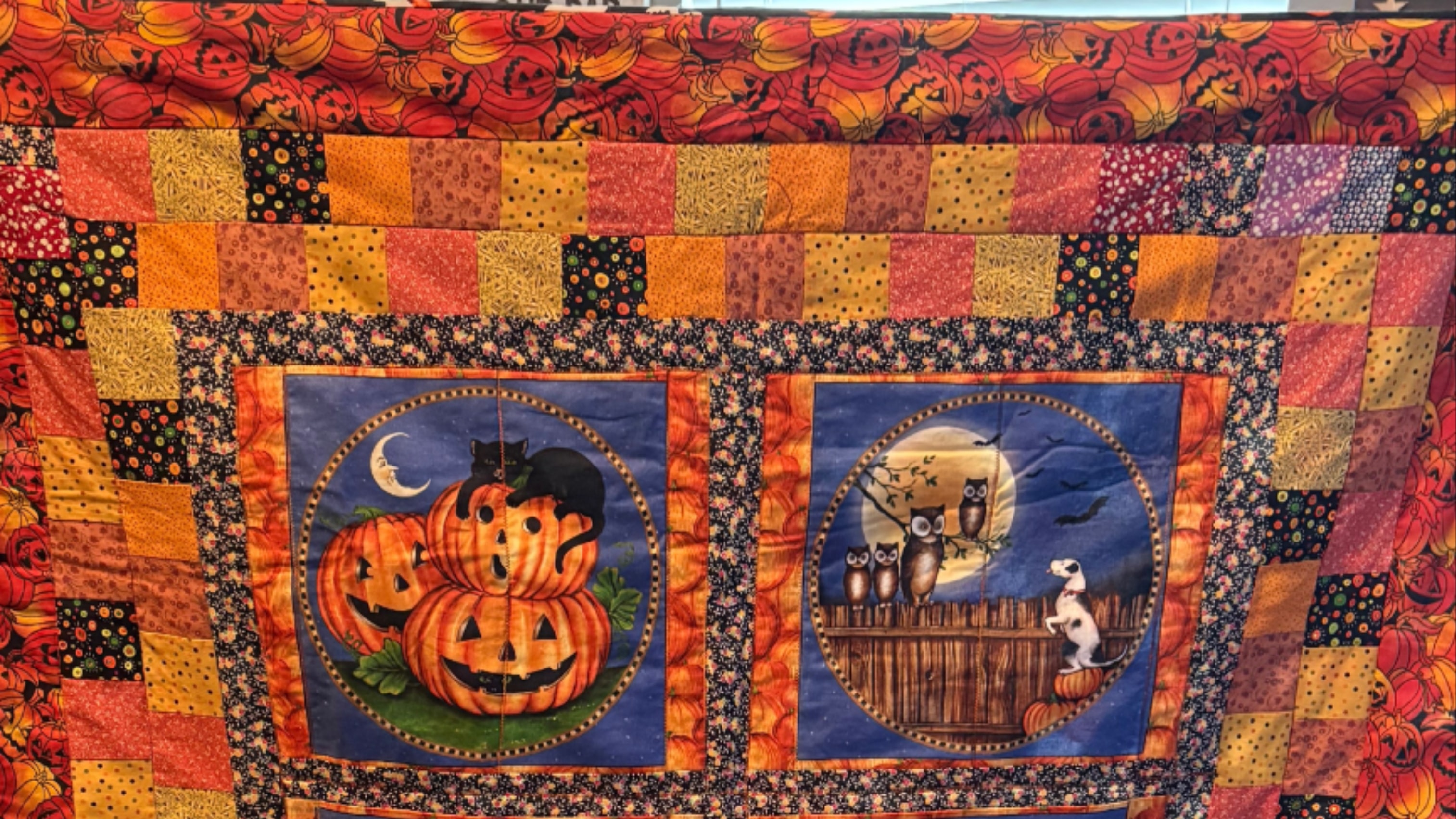 Handmade seasonal quilt in warm coordinated fabrics